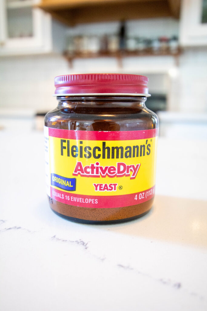 jar of Fleischmann's yeast on a marble counter