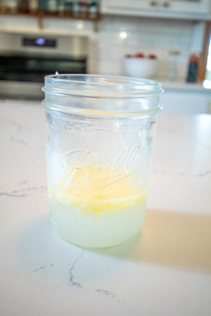 ball jar with water and melted butter in it