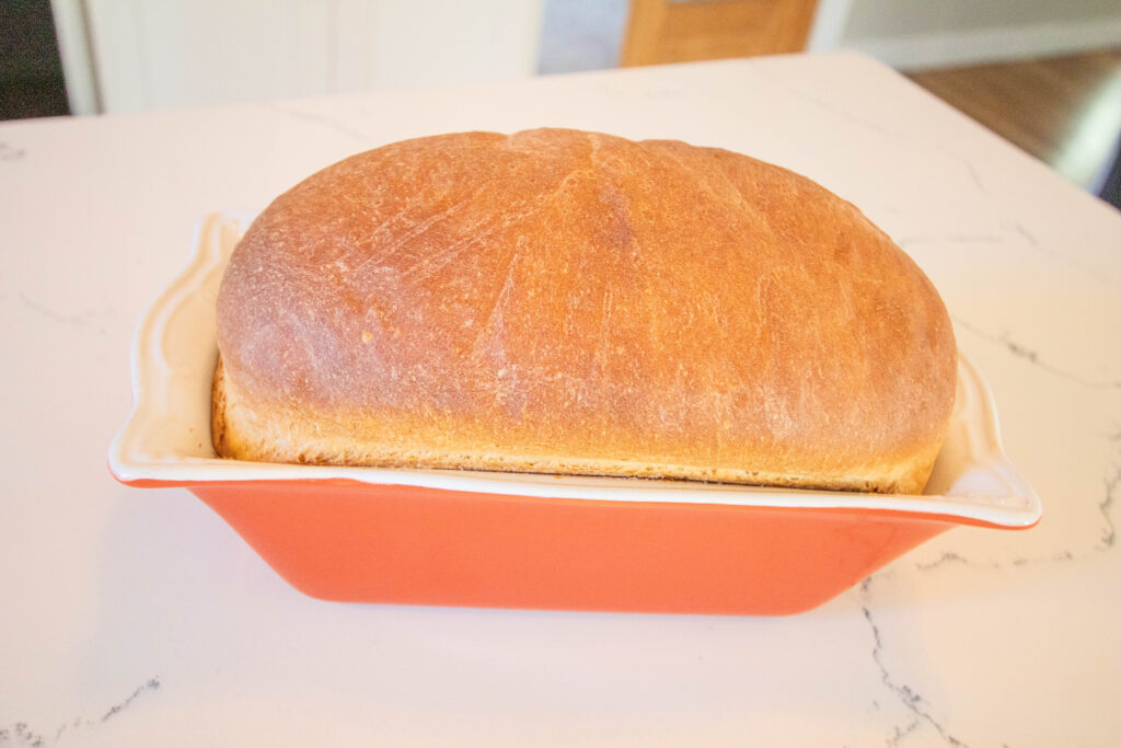 homemade sandwich bread in orange bread pan