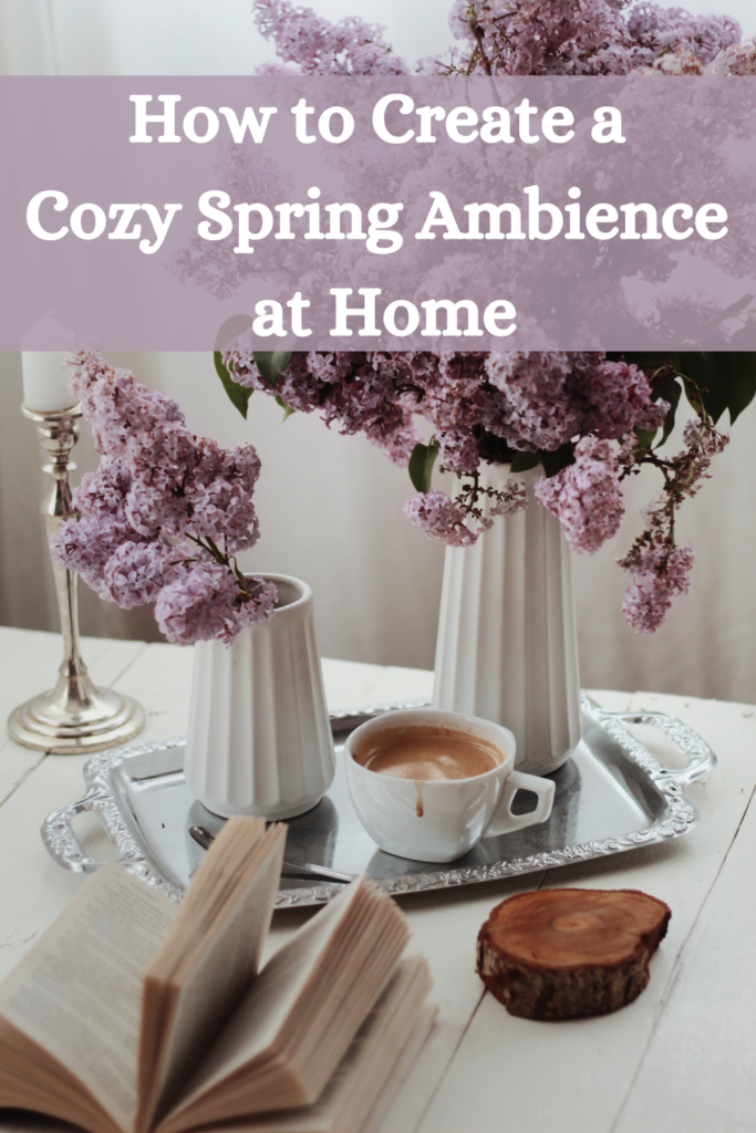 lovely floral arrangement on silver tray with coffee and a book with text "How to Create A Cozy Spring Ambience at Home"