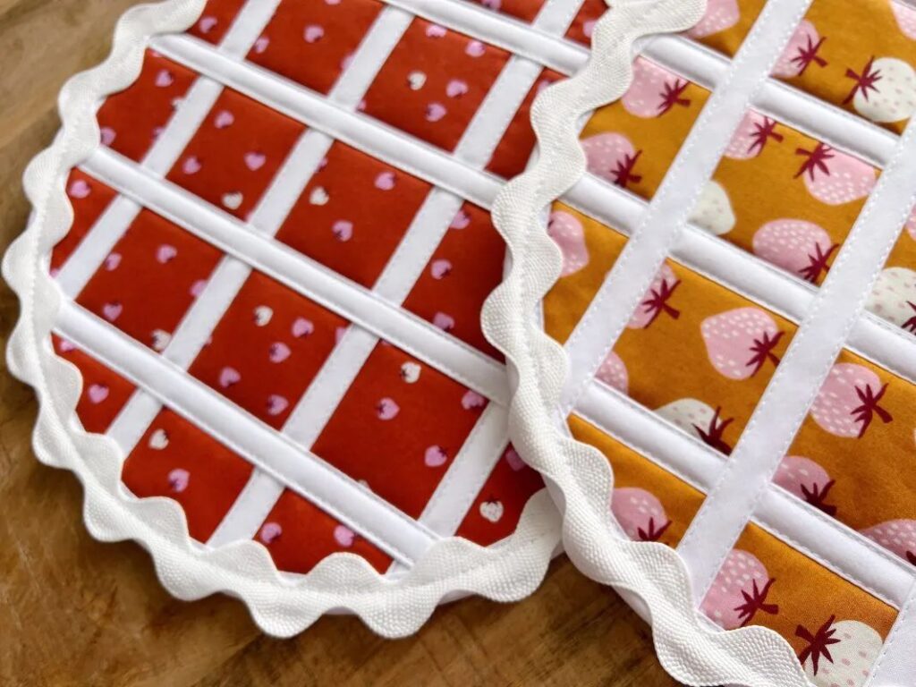 2 Pot holders in the shape of pies.