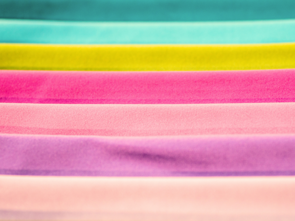 Rows of colorful quilting fabric.